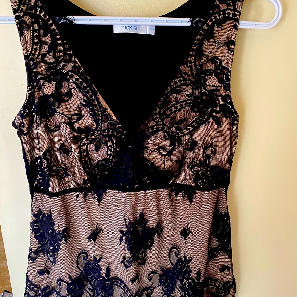 - Black lace sleeveless top.
